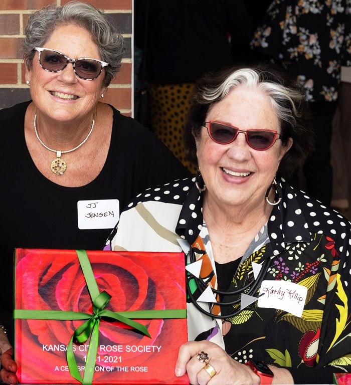 Jennifer Jenson (L) and Kathy Killip (R) showcasing Kathy's rose photo book, "A Celebration of the Rose."